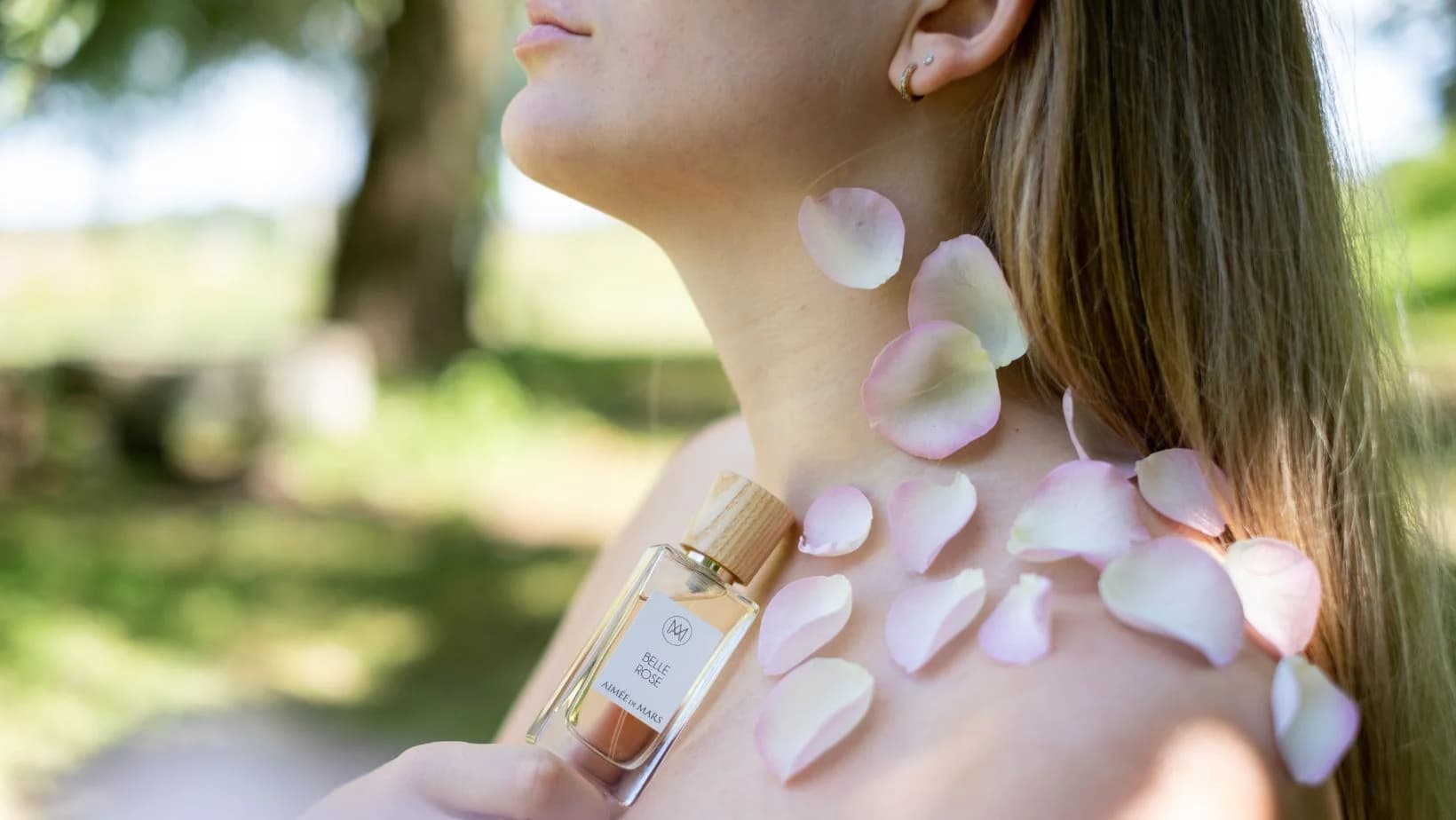 Belle Rose perfume with rose petals